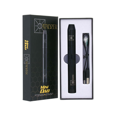 Katalyzer Mini Dab Wax Pen in box with charger, compact concentrate vaporizer for on-the-go use.