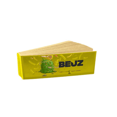 Beuz High Buddy Unbleached Filter Tips pack featuring vibrant yellow design and cartoon character.