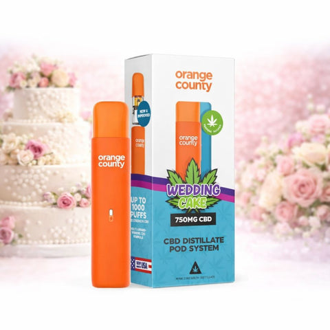Orange County - CBD Vape Pen 1ml Pod 750mg auf einer Hochzeitsdeko mit Kuchen und Blumen.